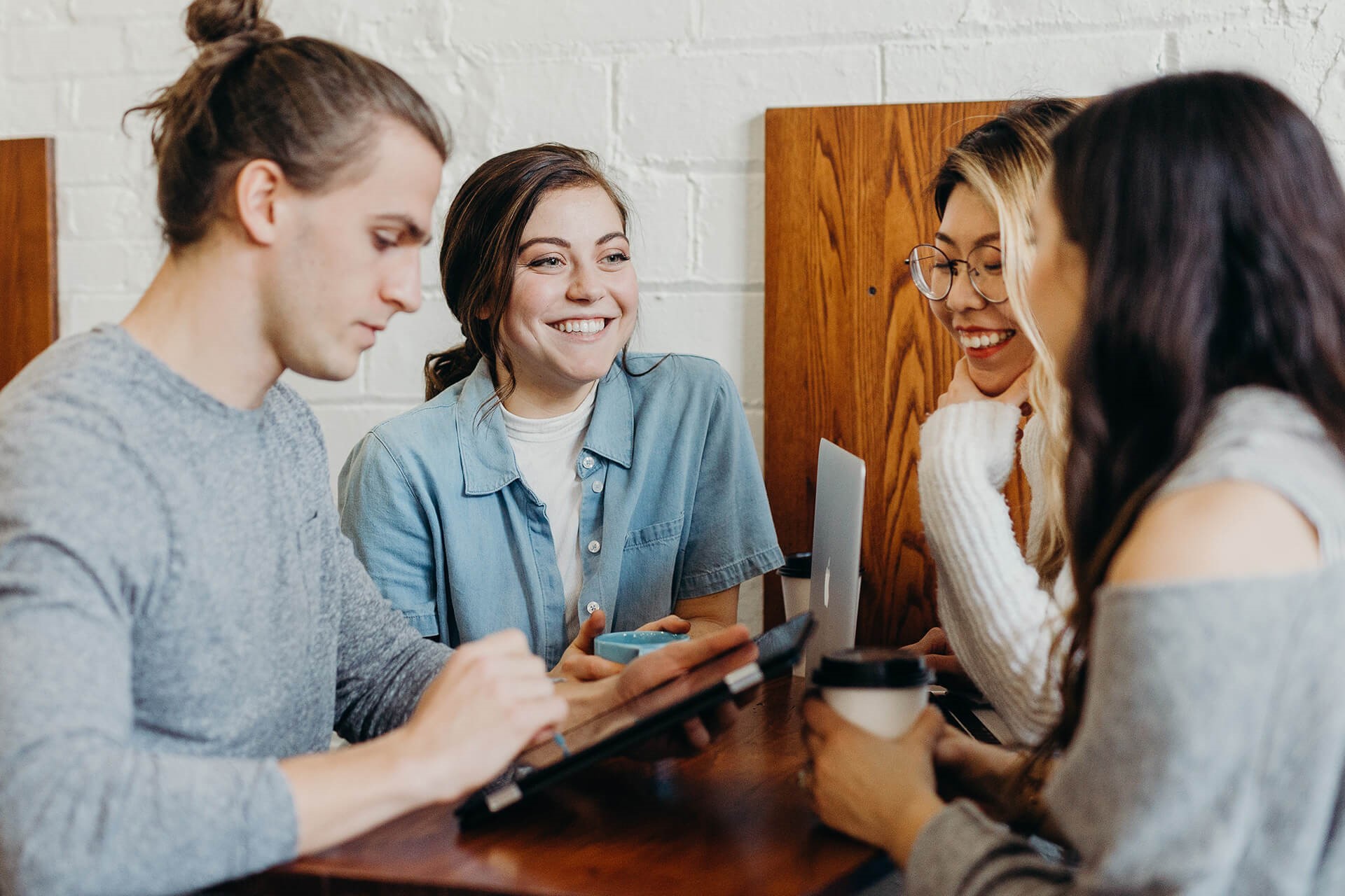 People collaborating around a tablet